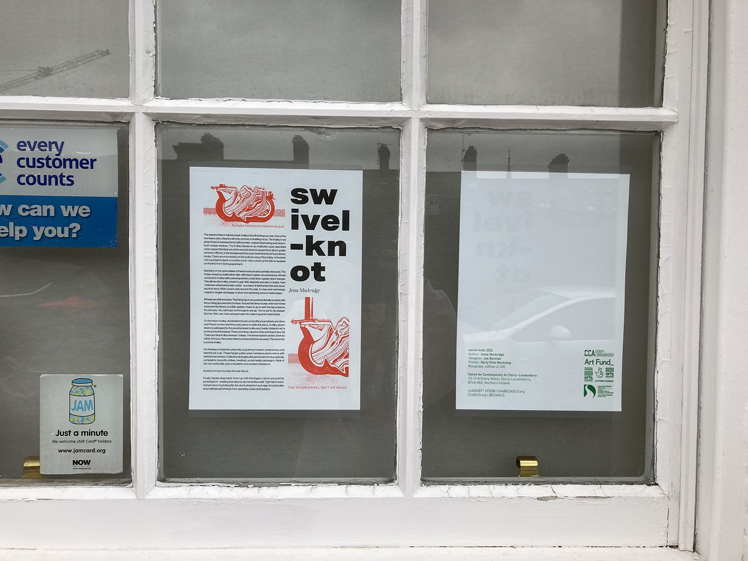 A4 poster stuck up in a window